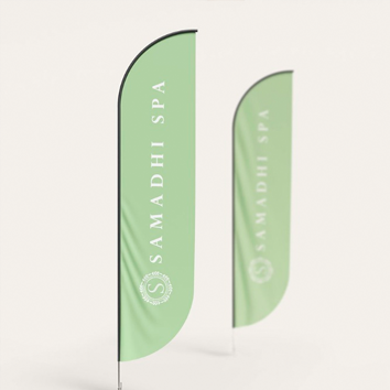 Two green feather flags with "SAMADHI SPA" branding.