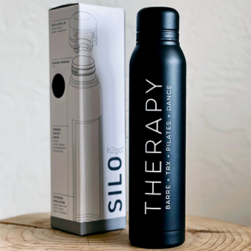 Black Silotherapy bottle with its box on a light surface.