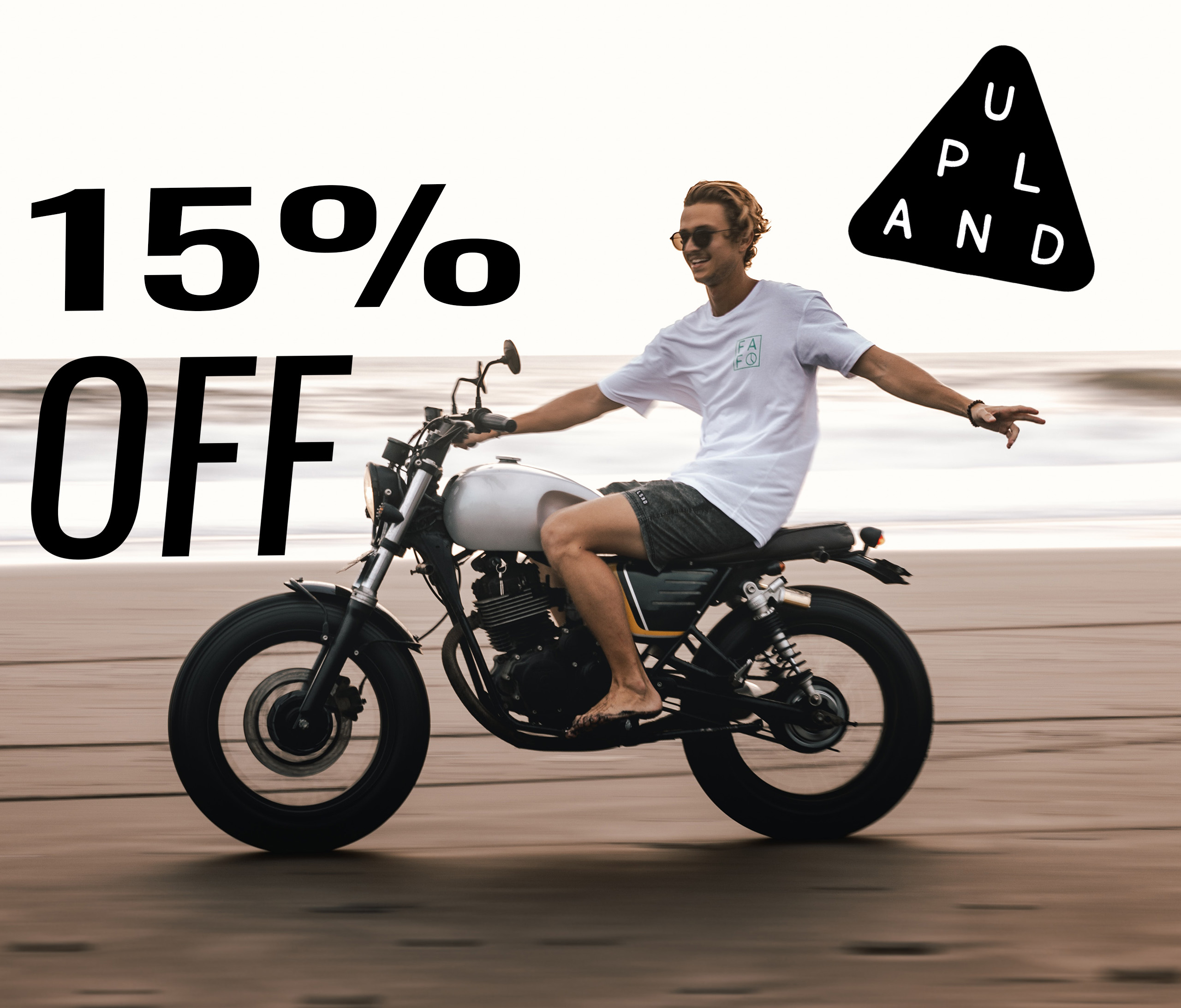 Man riding a motorcycle with 15% off sale text.